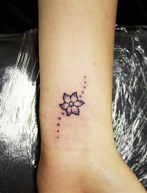 tattoo flower wrist|small flower tattoos on wrist.